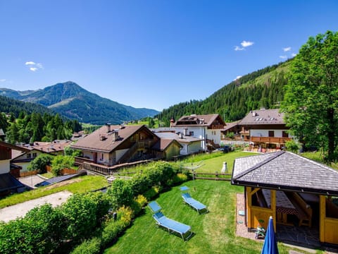 Plant, Sky, Cloud, Property, Mountain, Green, Nature, Natural Landscape, Building, Tree