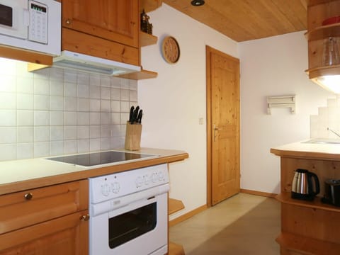 Cabinetry, Furniture, Building, Countertop, Drawer, Kitchen, Wood, Lighting, Interior Design, Kitchen Stove