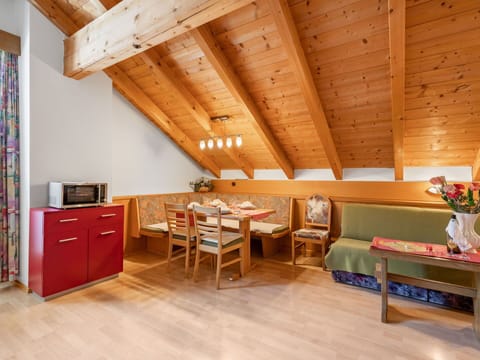 Table, Furniture, Wood, Cabinetry, Lighting, Orange, Interior Design, Hall, Chair, Flooring