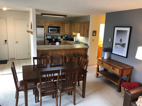 View from living room, through dining room, into kitchen. 