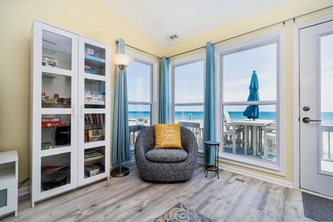 Living room with cozy swivel chair; see the ocean from inside as well as out. 