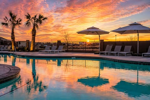 A wide high quality photorealistic sunset poolsi
