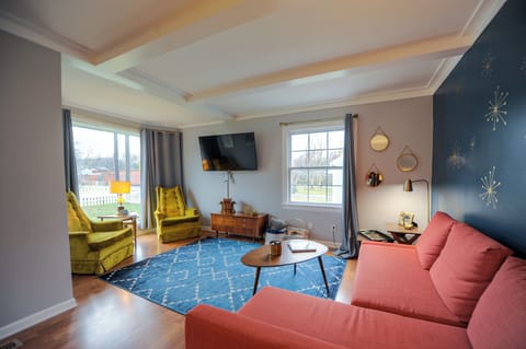 Get comfy in our retro living room.  Nothing retro about that Roku Smart TV!