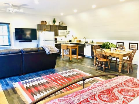 View from bed in nook area towards living room and kitchen 