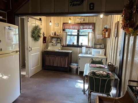 Cozy kitchenette with full-size refrigerator, toaster oven, microwave, crockpot