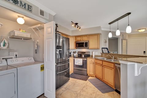 Kitchen w/ full size washer and dryer