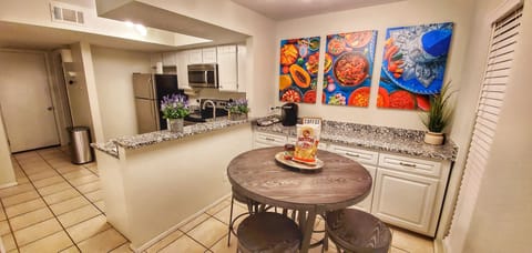 The breakfast nook & coffee bar offers seating for four, & storage