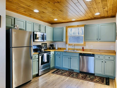 Full kitchen with stainless appliances and all the cookware you need