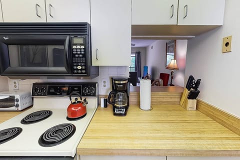 Kitchen is basic with a pass thru to the dining area.  Makes setting the table a breeze!