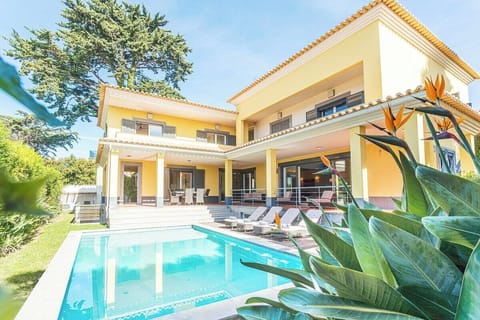 Luxury villa with pool and garden.