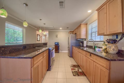 Kitchen has a standard drip coffee maker.