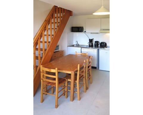 Furniture, Property, Cabinetry, Countertop, Wood, Kitchen Appliance, Kitchen Stove, Lighting, Gas Stove, Flooring