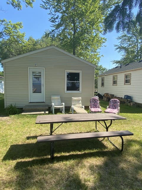 View of the cottage from the lake.  You will have the chairs and picnic table