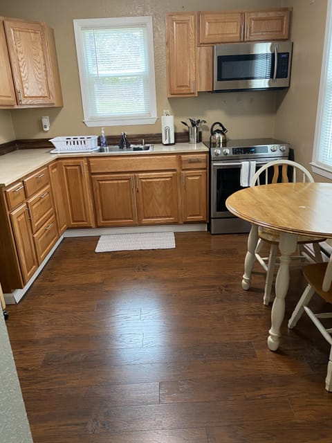 Fully stocked kitchen stove, microwave and dinning table 
