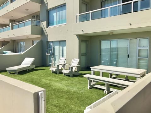 Outside view of the apartment patio from the beach access gate.