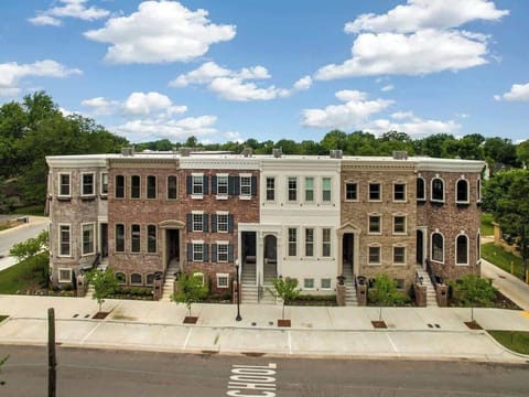 The Brownstones is a brand-new collection of 3.5 story town homes located primely on NW A Street, just ONE BLOCK from Bentonville's downtown square. Ours is the 3rd unit (red brick with shutters).