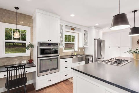 Here, you'll find everything you need to cook the perfect meal, bake your favorite dessert or make a great cup of coffee. This space also has a desk area for catching up on emails or taking a Zoom call!