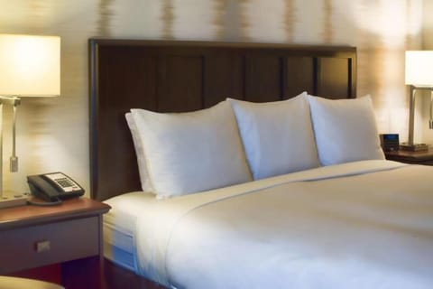 Bedroom with a comfortable King size bed. Interior and views may vary based on location and availability.