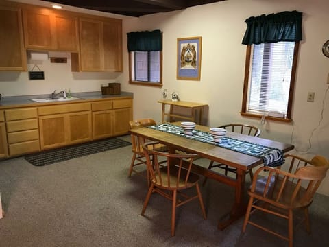 Downstairs living room with table for puzzles or games.