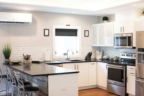 Kitchen- Fully stocked and modern with everything you need to cook and gather.