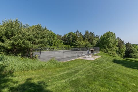 Clay tennis court in season.