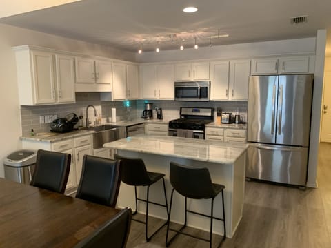 Kitchen with granite counter tops, stainless appliances, keurig  gas range!