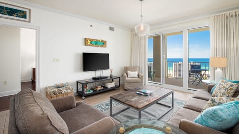 The living room is the perfect place to gather together — whether you’re relaxing with a movie night or stepping out onto the balcony to enjoy the fresh air and views.