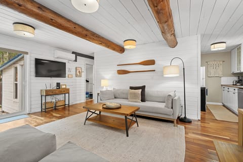 Cozy couch in the living room with on trend lake decor & stylish details.