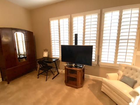 Armoire, small computer station, smart TV.