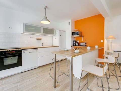 Furniture, Room, Property, Kitchen, Countertop, Interior Design, Yellow, Cabinetry, Floor, Building