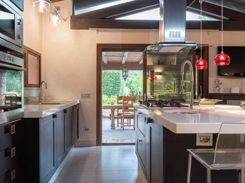 Kitchen, Countertop, Furniture, Interior Design, Kitchen Appliance, Cabinetry, Light Fixture, Flooring, Ceiling, Major Appliance