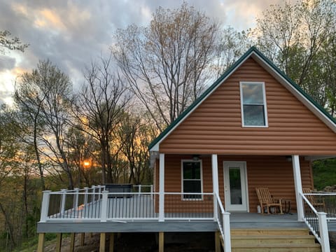 Sun setting behind cabin