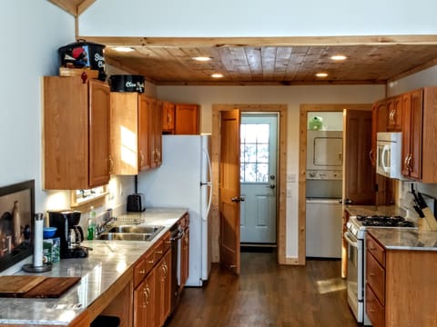 Kitchen has marble counters, gas stove and oven, everything needed. Laundry too!