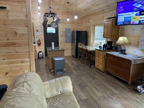 Spacious fully equipped kitchen and great room with dimmable pendant lighting. 