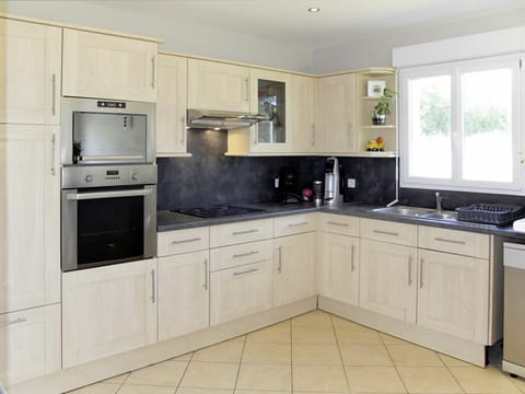 Cabinetry, Countertop, Furniture, Room, Kitchen, Property, Major Appliance, Interior Design, Floor, Cupboard