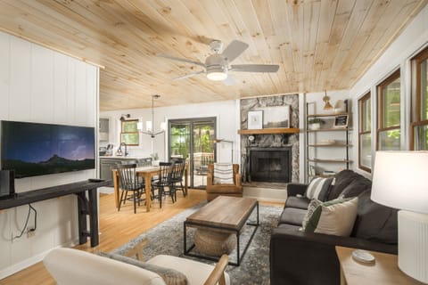 A cozy living space with a wood burning fireplace.
