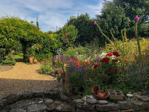 Cottage Garden, leading onto a small orchard and a summer house