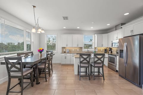 Dining room area can seat up to 6 people with two additional seats at the island bar