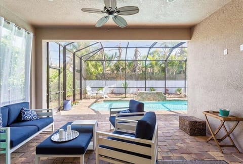 Enjoy this stunning outdoor oasis featuring a private pool, perfect for relaxing and unwinding in the Florida sunshine. The spacious pool area offers comfortable loungers, a shaded seating area, and plenty of space for fun and outdoor entertaining
