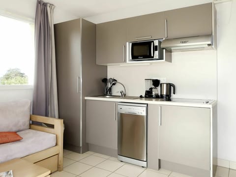 Room, Furniture, Property, Kitchen, Cabinetry, Interior Design, Building, Major Appliance, House, Kitchen Stove