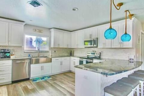 Downstairs full kitchen with breakfast bar seating 4