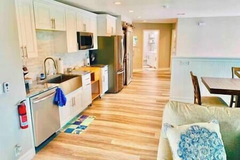 Upstairs kitchen with dishwasher, range, microwave, fridge and freezer