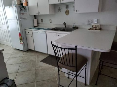 large kitchen, dishwasher, fridge, microwave, stove, washer & dryer, pantry