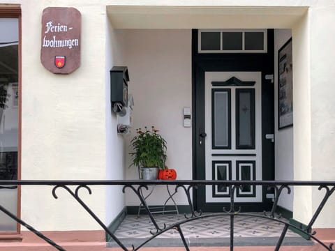 Property, Table, Flowerpot, Plant, Building, Houseplant, Window, Architecture, Door, Wood