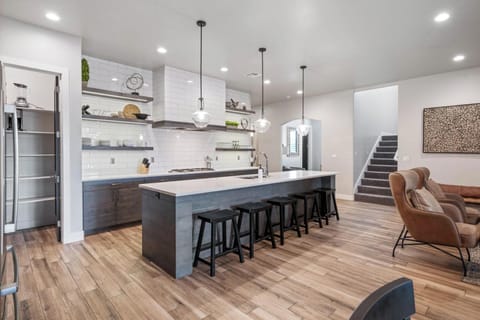 Deluxe kitchen is stocked with plenty of appliances and utensils for cooking