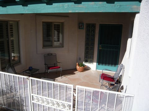 Front patio, middle window is kitchen sink area