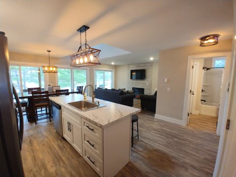 Open kitchen, dining room, and living room.