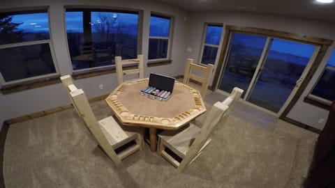 Game Table with 4 custom wood chairs and 8 extra chairs