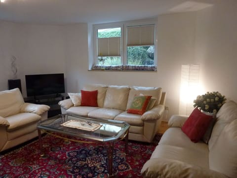 Living Room, Room, Property, Furniture, Interior Design, Couch, Floor, Table, Coffee Table, Building