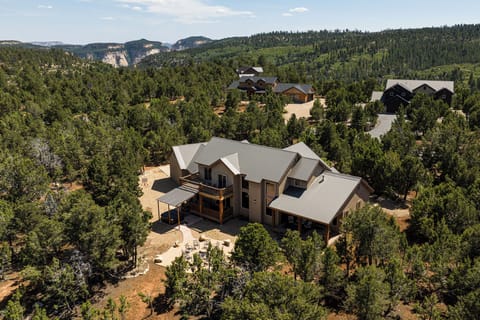 Aerial view of the house with Zion Park in the background